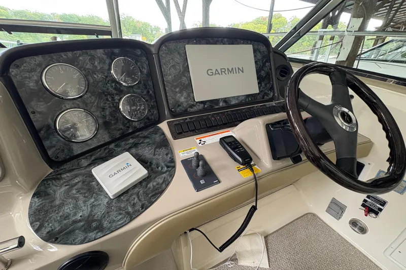  Yacht Photos Pics 2008 Sea Ray 40 Sundancer helm with Garmin navigation system and steering wheel.