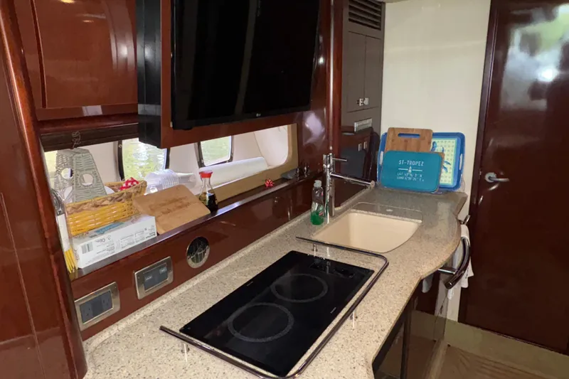  Yacht Photos Pics Luxurious kitchen interior of 2008 Sea Ray 40 Sundancer yacht with modern amenities.