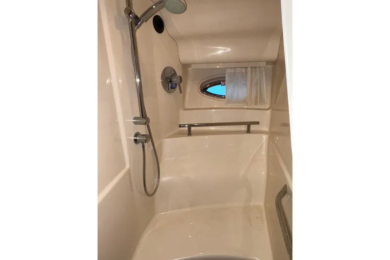  Yacht Photos Pics Shower area in 2008 Sea Ray 40 Sundancer yacht with chrome fixtures and porthole window.