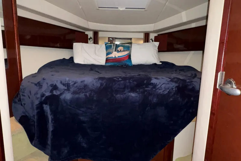  Yacht Photos Pics Cozy cabin interior of 2008 Sea Ray 40 Sundancer with plush bedding.