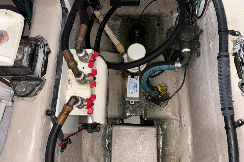  Yacht Photos Pics Engine compartment of a 2008 Sea Ray 40 Sundancer with visible hoses and components.