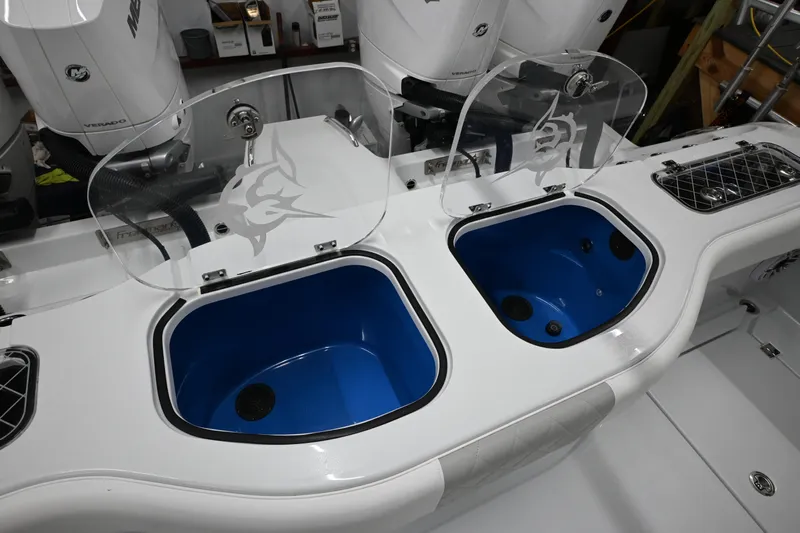  Yacht Photos Pics 2024 Freeman 43 boat with dual livewells and transparent lids, featuring a sleek design.