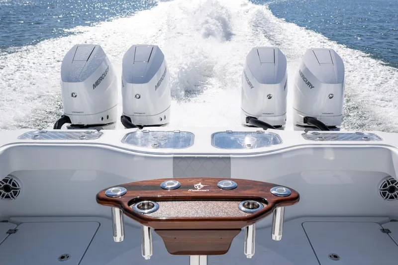  Yacht Photos Pics 2024 Freeman 43 boat with four Mercury Verado engines cruising on water.