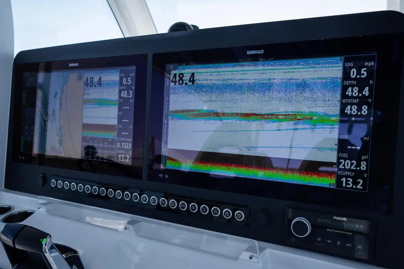  Yacht Photos Pics Dashboard of 2024 Freeman 43 boat with dual Simrad displays showing navigation data.
