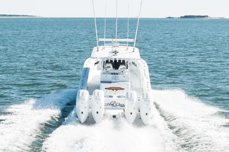  Yacht Photos Pics 2024 Freeman 43 boat cruising on open water with four powerful engines.