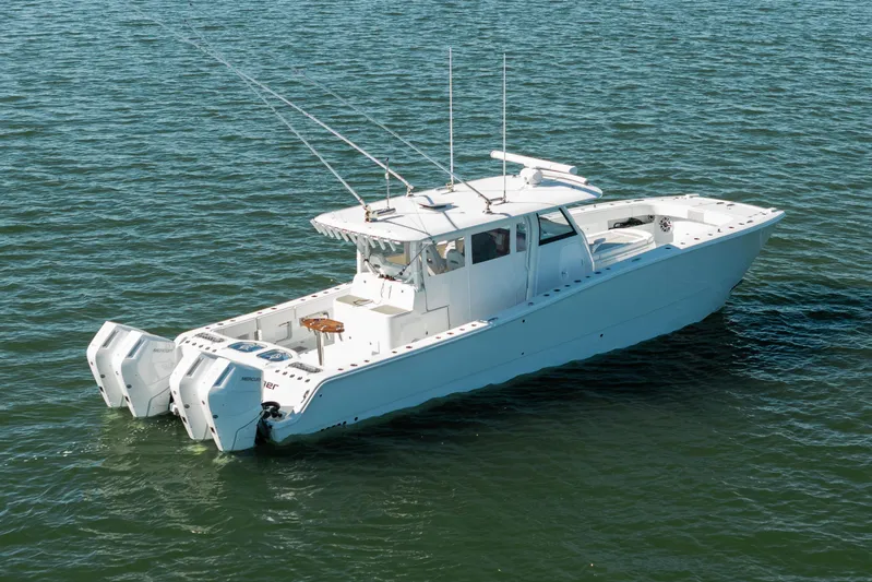  Yacht Photos Pics 2024 Freeman 43 boat on water, featuring dual outboard engines and spacious deck.