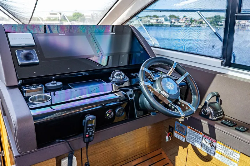 My Way Yacht Photos Pics 2019 Cruisers Yachts 54 Cantius helm with modern controls and navigation screens.