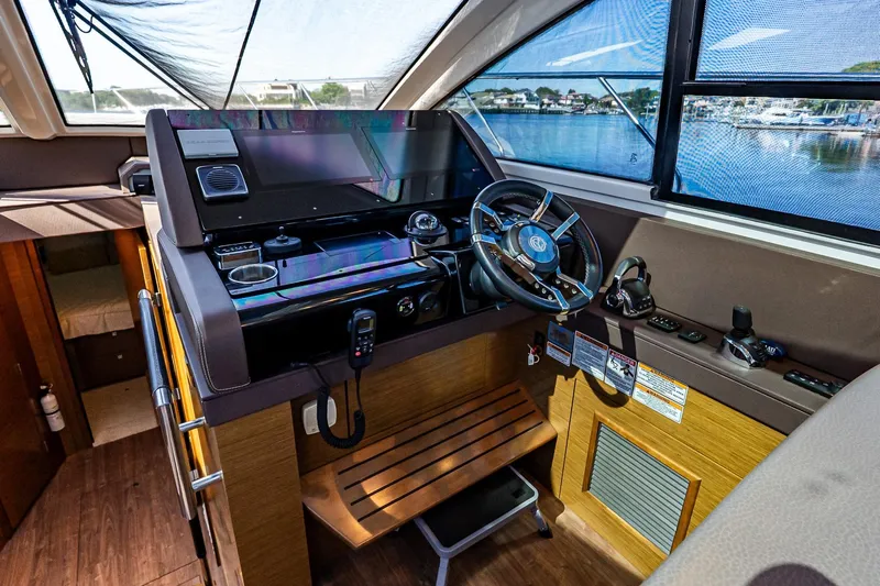 My Way Yacht Photos Pics 2019 Cruisers Yachts 54 Cantius helm with modern controls and panoramic view.