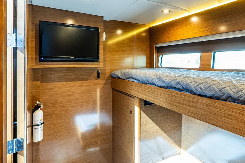 My Way Yacht Photos Pics Luxurious 2019 Cruisers Yachts 54 Cantius cabin with TV and modern wood finish.