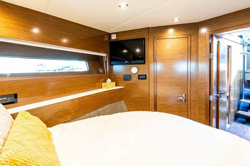 My Way Yacht Photos Pics Luxurious cabin interior of 2019 Cruisers Yachts 54 Cantius with modern wood finish.