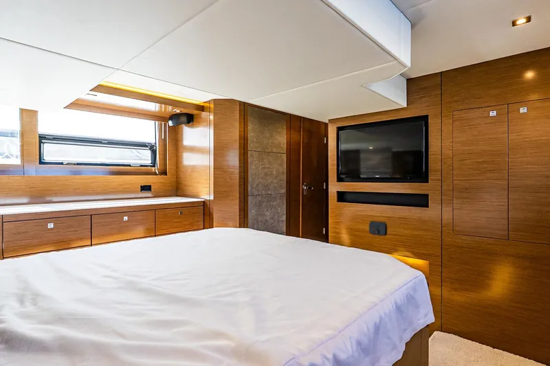 My Way Yacht Photos Pics Luxurious bedroom interior of 2019 Cruisers Yachts 54 Cantius with modern wood finishes.