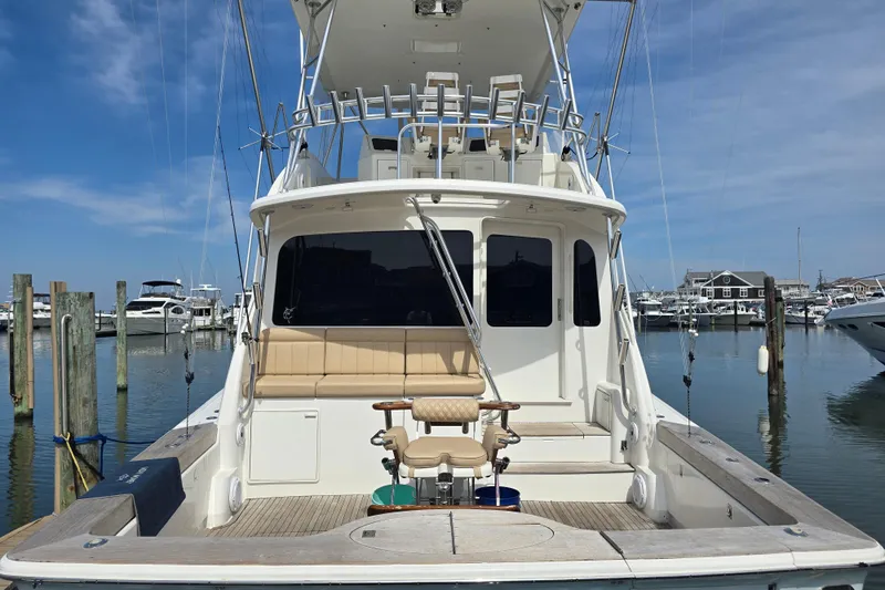  Yacht Photos Pics 2004 Ocean Yachts 50 Super Sport docked at marina, clear sky, fishing chair visible.