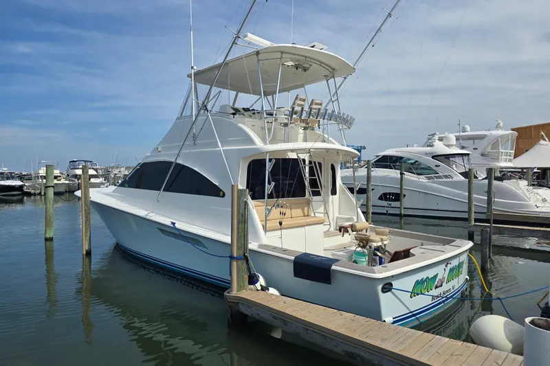  Yacht Photos Pics 2004 Ocean Yachts 50 Super Sport docked at marina, clear sky background.