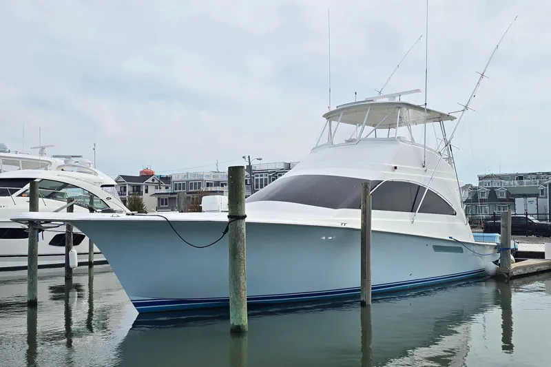  Yacht Photos Pics 2004 Ocean Yachts 50 Super Sport docked in a marina.