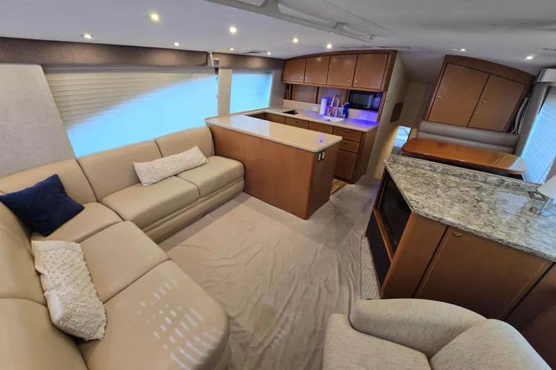  Yacht Photos Pics Luxurious interior of 2004 Ocean Yachts 50 Super Sport with modern kitchen and cozy seating.