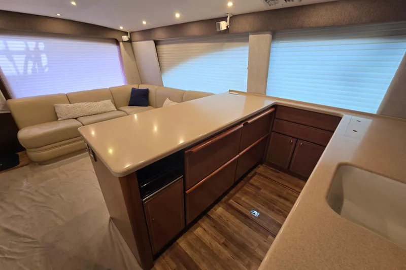  Yacht Photos Pics Luxurious interior of 2004 Ocean Yachts 50 Super Sport with modern kitchen and seating area.