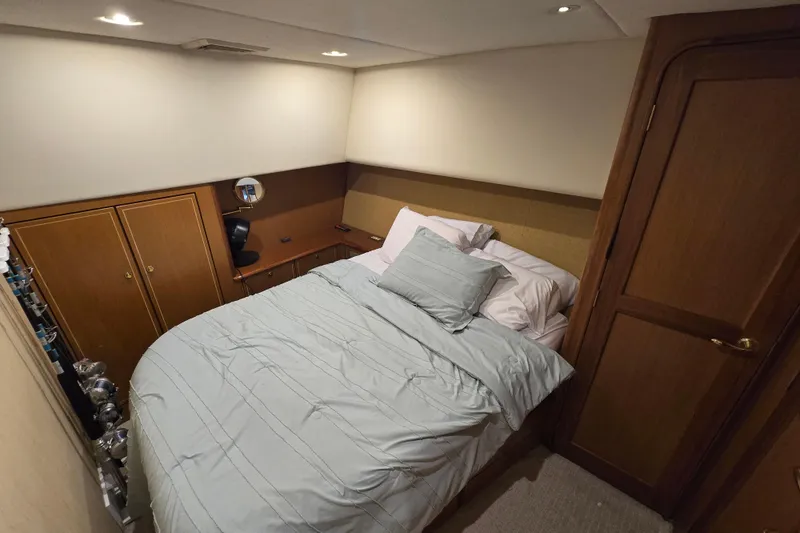  Yacht Photos Pics Luxurious bedroom interior of 2004 Ocean Yachts 50 Super Sport with cozy bedding.
