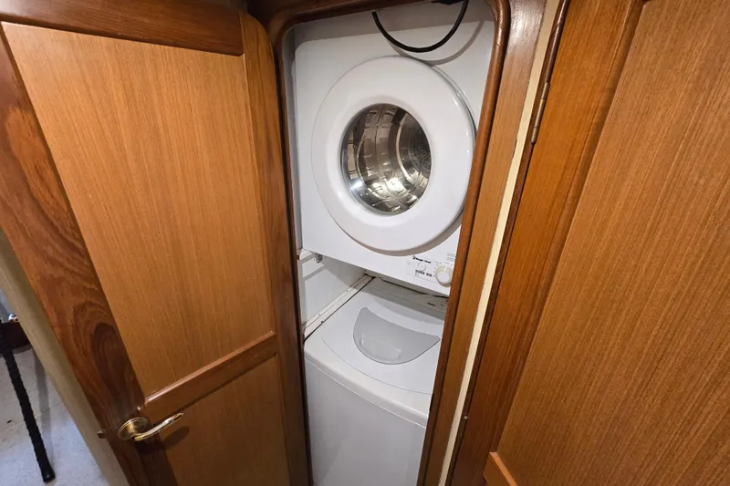  Yacht Photos Pics Laundry area with washer and dryer inside 2004 Ocean Yachts 50 Super Sport.