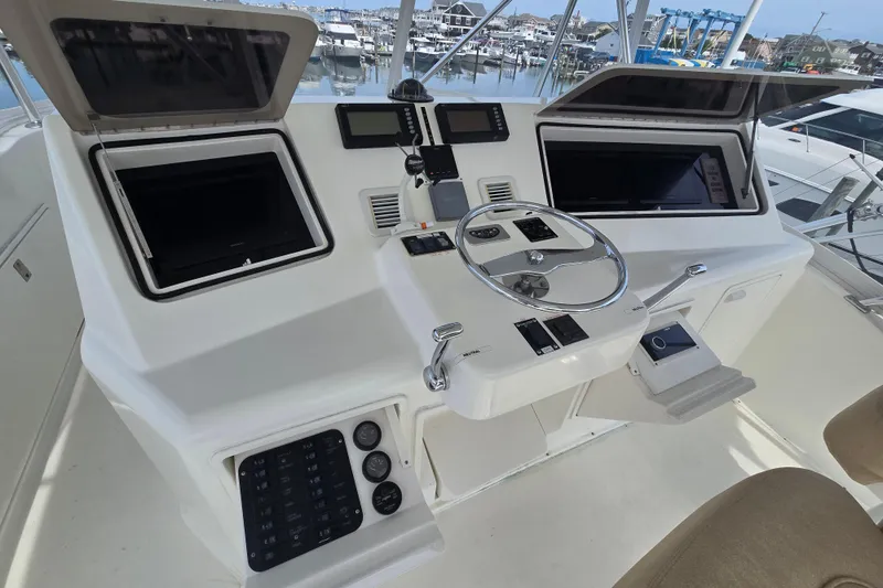  Yacht Photos Pics Cockpit of 2004 Ocean Yachts 50 Super Sport with steering wheel and navigation controls.