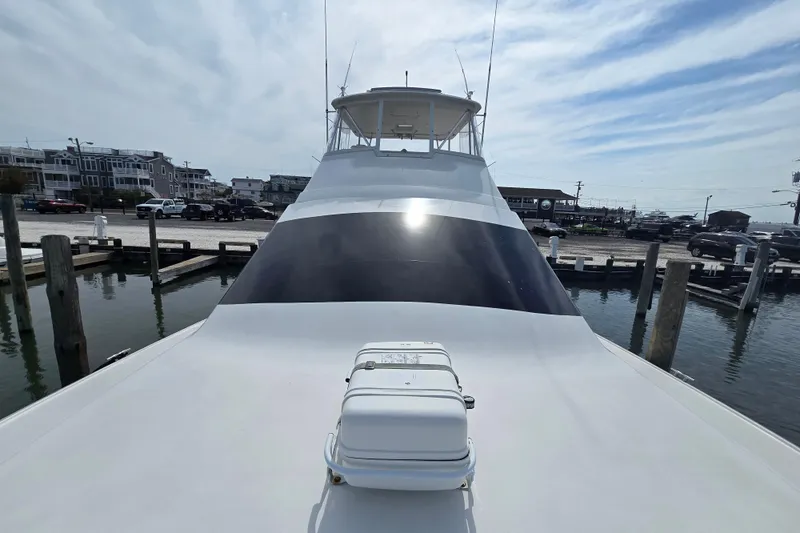  Yacht Photos Pics 2004 Ocean Yachts 50 Super Sport docked at marina, showcasing sleek design and spacious deck.