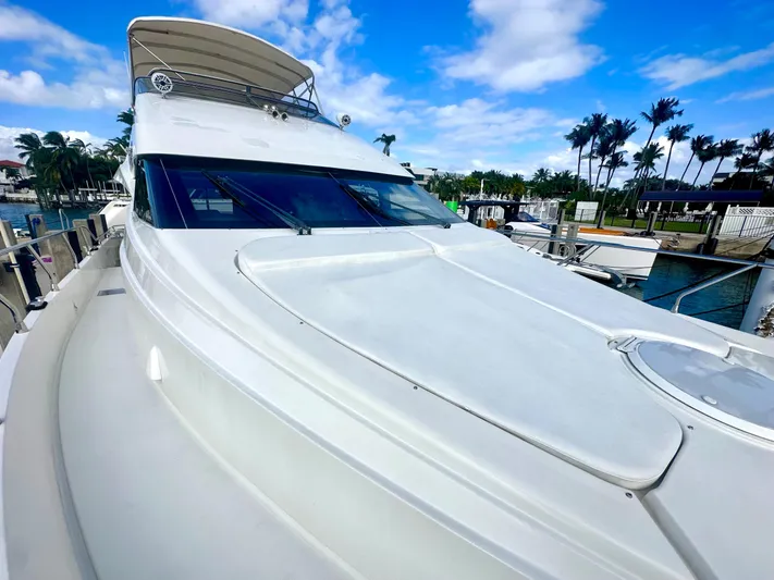 Big Daddy Yacht Photos Pics 2007 Marquis 59 Markham Edition yacht docked under a clear blue sky.