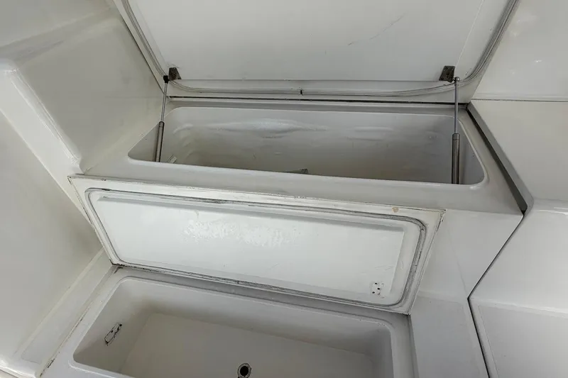 Maritere Yacht Photos Pics Open storage compartment on a 1999 Viking 58 Convertible boat.