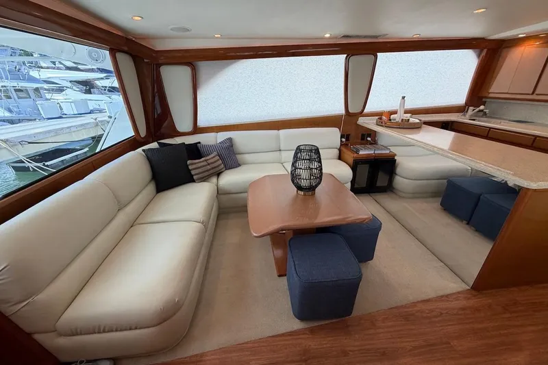 Maritere Yacht Photos Pics Luxurious interior of a 1999 Viking 58 Convertible yacht with elegant seating and decor.