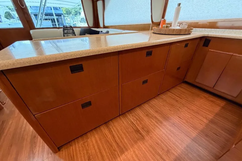 Maritere Yacht Photos Pics Interior of 1999 Viking 58 Convertible yacht with wooden cabinetry and countertop.