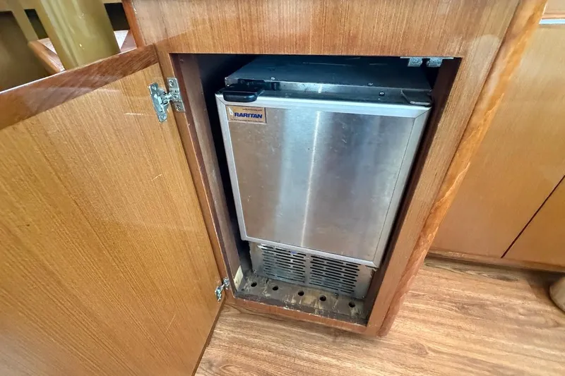 Maritere Yacht Photos Pics Raritan ice maker inside wooden cabinet on 1999 Viking 58 Convertible yacht.