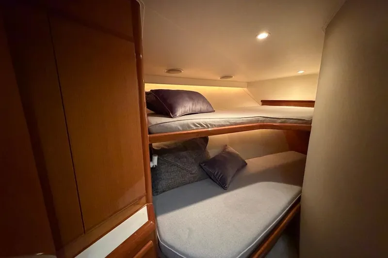 Maritere Yacht Photos Pics Cozy bunk beds in 1999 Viking 58 Convertible yacht cabin.