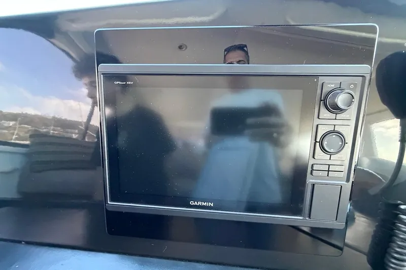 Maritere Yacht Photos Pics Garmin GPS device on 1999 Viking 58 Convertible yacht dashboard.