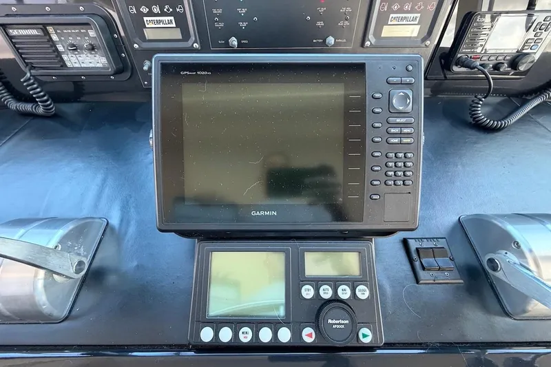 Maritere Yacht Photos Pics Control panel of a 1999 Viking 58 Convertible with Garmin GPS and navigation equipment.