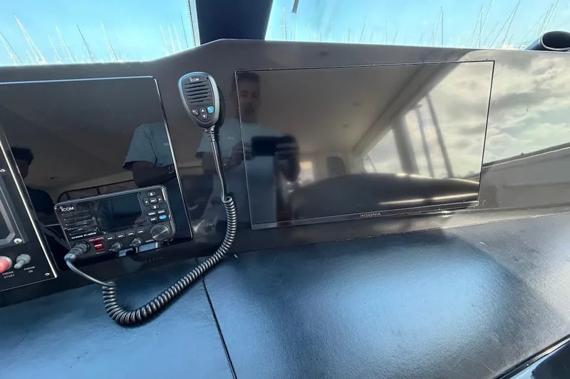 Maritere Yacht Photos Pics Control panel of a 1999 Viking 58 Convertible yacht with radio and screen.