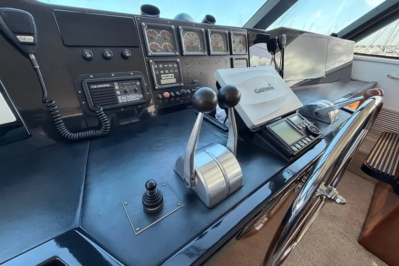 Maritere Yacht Photos Pics Control panel of a 1999 Viking 58 Convertible yacht with navigation equipment.