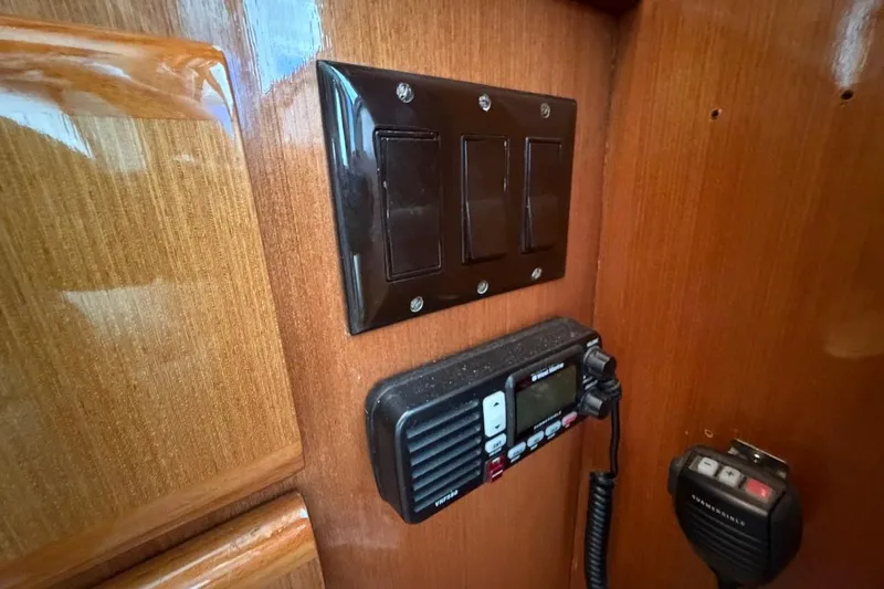 Maritere Yacht Photos Pics Control panel and radio on 1999 Viking 58 Convertible yacht's wooden interior.