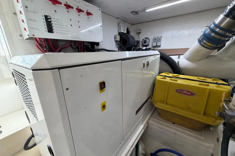 Maritere Yacht Photos Pics Engine room of 1999 Viking 58 Convertible with electrical panel and equipment.