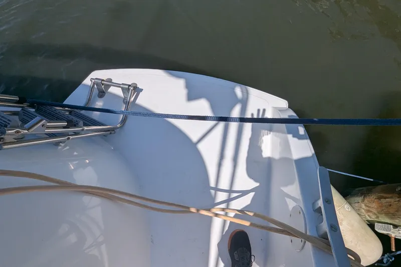 Sometimes Nancy Yacht Photos Pics 2003 Fountaine Pajot Maryland 37 boat deck with ladder and ropes, docked by water.