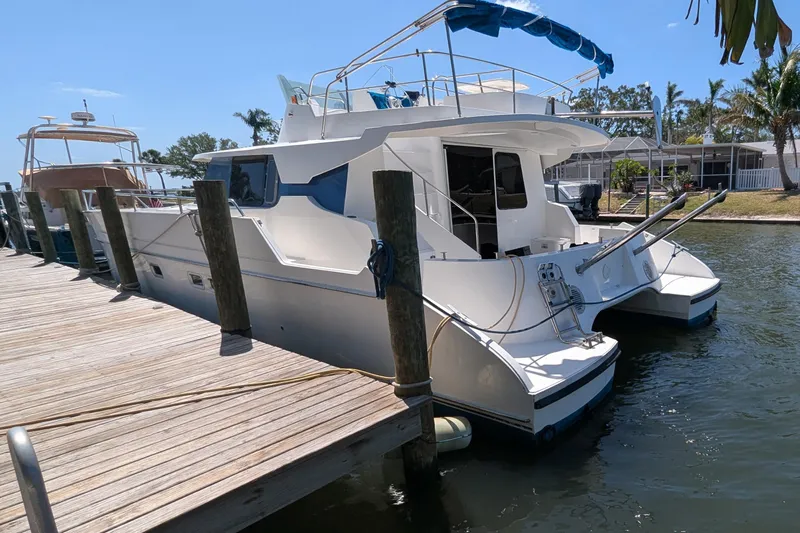 Sometimes Nancy Yacht Photos Pics 2003 Fountaine Pajot Maryland 37 yacht docked at marina under clear blue sky.
