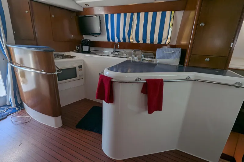 Sometimes Nancy Yacht Photos Pics Interior of 2003 Fountaine Pajot Maryland 37 yacht kitchen with modern amenities.
