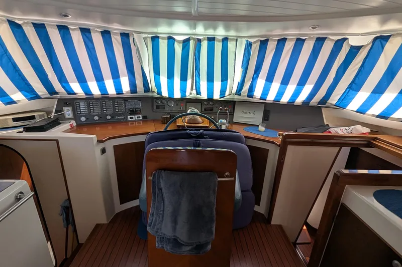 Sometimes Nancy Yacht Photos Pics Interior of 2003 Fountaine Pajot Maryland 37 yacht with striped window covers.