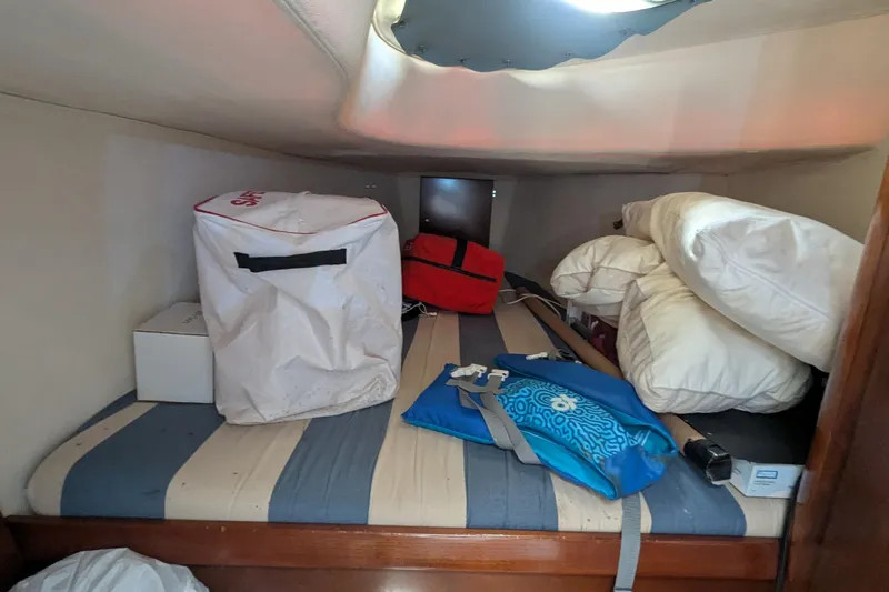 Sometimes Nancy Yacht Photos Pics Cabin storage area in 2003 Fountaine Pajot Maryland 37, with bags and cushions.