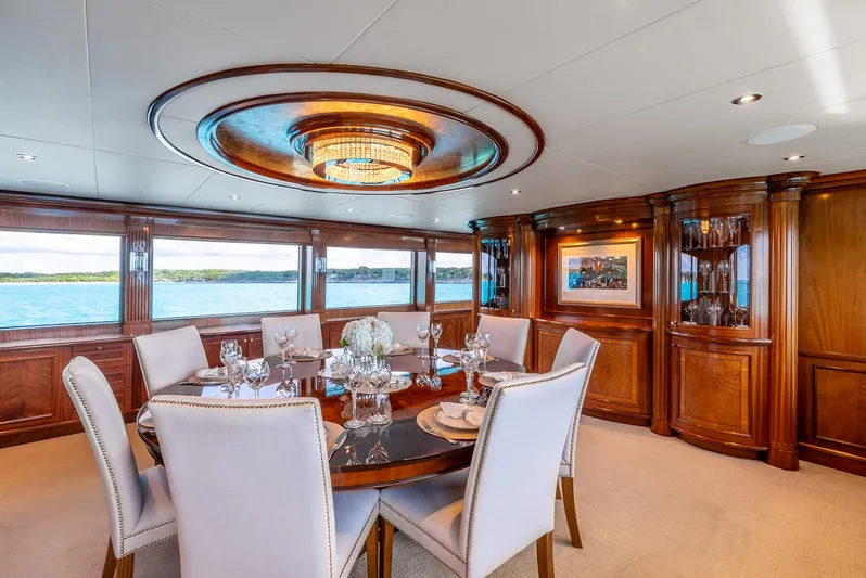 Calliope Yacht Photos Pics Luxurious dining area on 2007 Richmond Yachts Semi Displacement, featuring elegant wood paneling and ocean views.