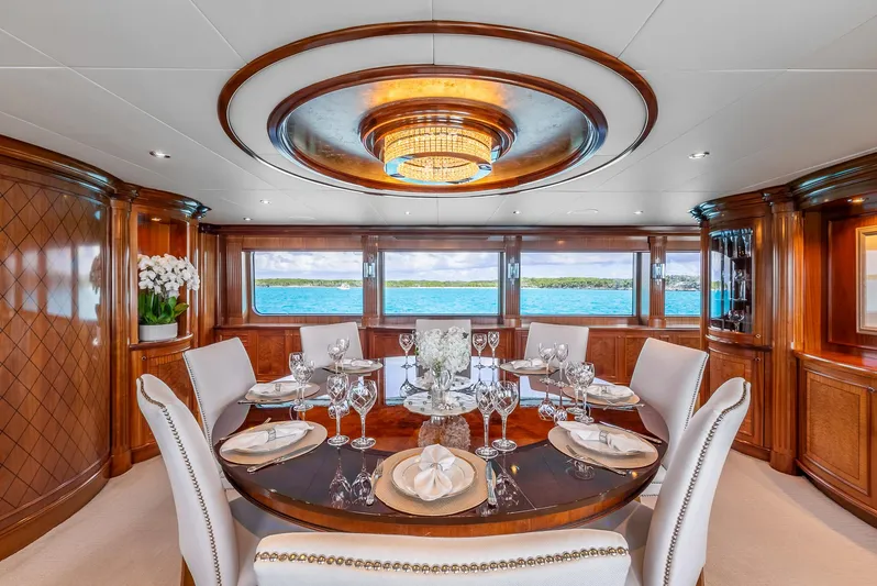 Calliope Yacht Photos Pics Luxurious dining area on 2007 Richmond Yachts Semi Displacement, featuring elegant wood and ocean views.