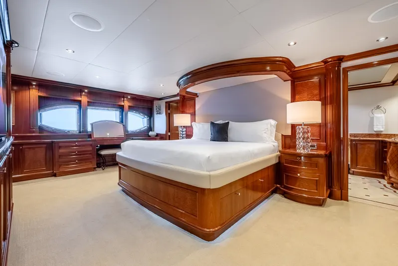 Calliope Yacht Photos Pics Luxurious Richmond Yachts 2007 bedroom with elegant wood finishes and large bed.