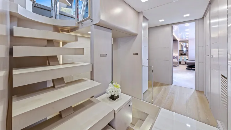 Chitochi Yacht Photos Pics Luxurious interior of 2016 Custom Line Ferretti yacht with modern staircase and elegant decor.