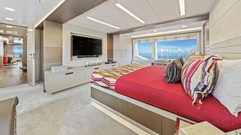 Chitochi Yacht Photos Pics Luxurious yacht bedroom with ocean view, featuring modern design and vibrant bedding. Custom Line Ferretti Group 2016.