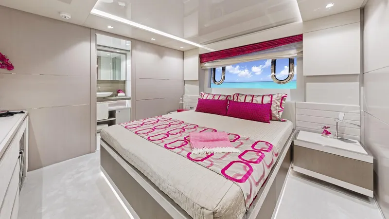 Chitochi Yacht Photos Pics Luxurious yacht bedroom with pink accents, ocean view, and modern design, Custom Line Ferretti Group 2016.