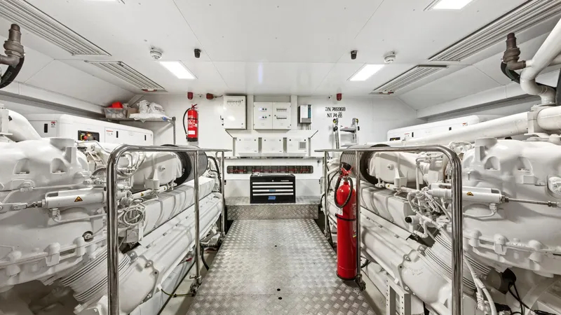 Chitochi Yacht Photos Pics Engine room of 2016 Custom Line Ferretti Group yacht, featuring machinery and safety equipment.