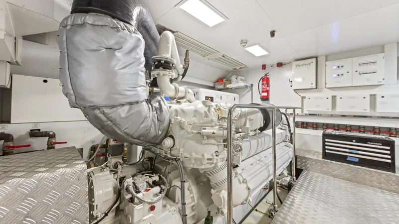 Chitochi Yacht Photos Pics Engine room of 2016 Custom Line Ferretti Group yacht, featuring advanced machinery and control panels.