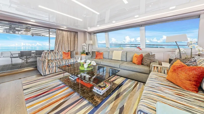 Chitochi Yacht Photos Pics Luxurious yacht interior with colorful decor, large windows, and ocean view; Custom Line Ferretti Group 2016.